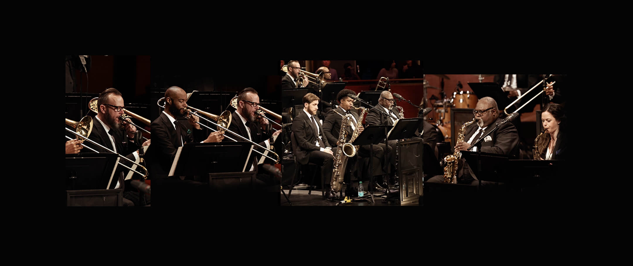 Jazz orchestra performing on stage in formal black suits.