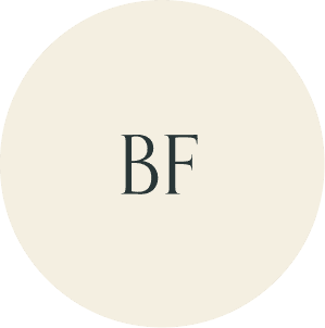 Cream circular monogram with BF initials.