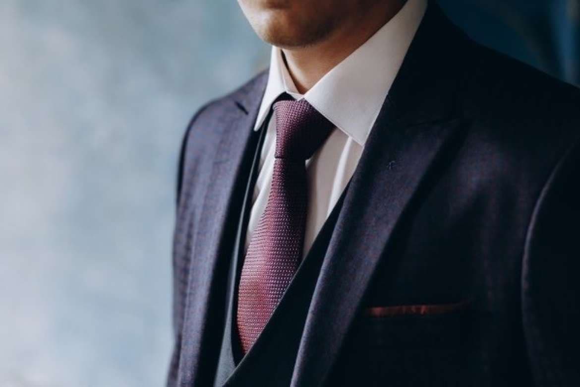 New suit jacket displayed for proper care.