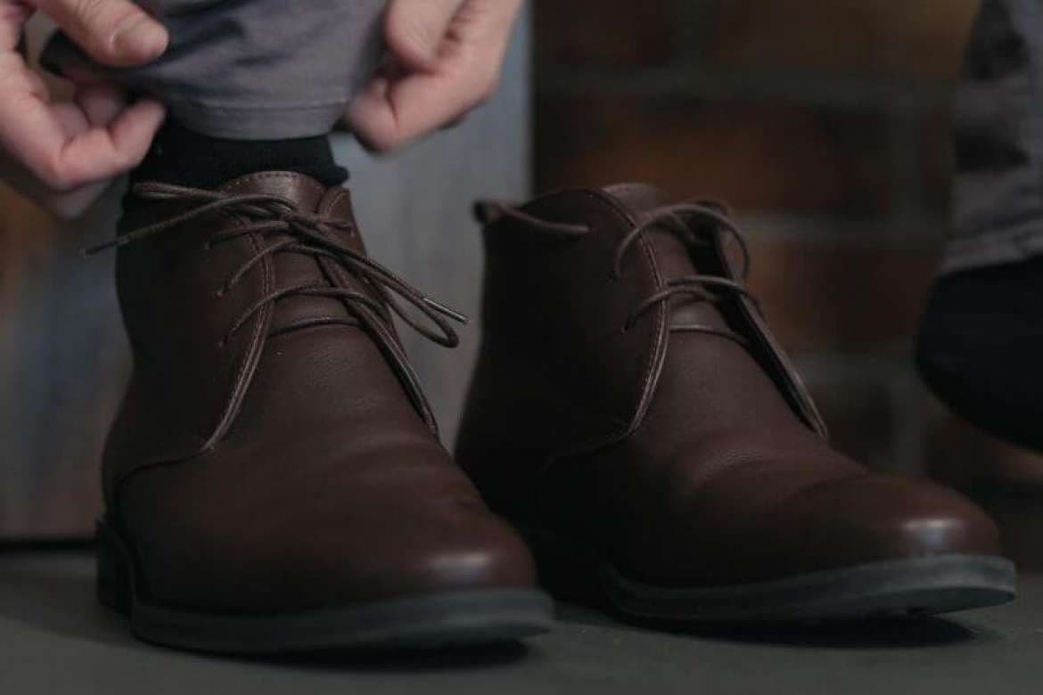 Bespoke footwear displayed with formal menswear.