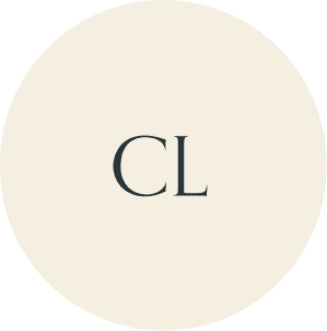 Cream circular monogram with CL initials.