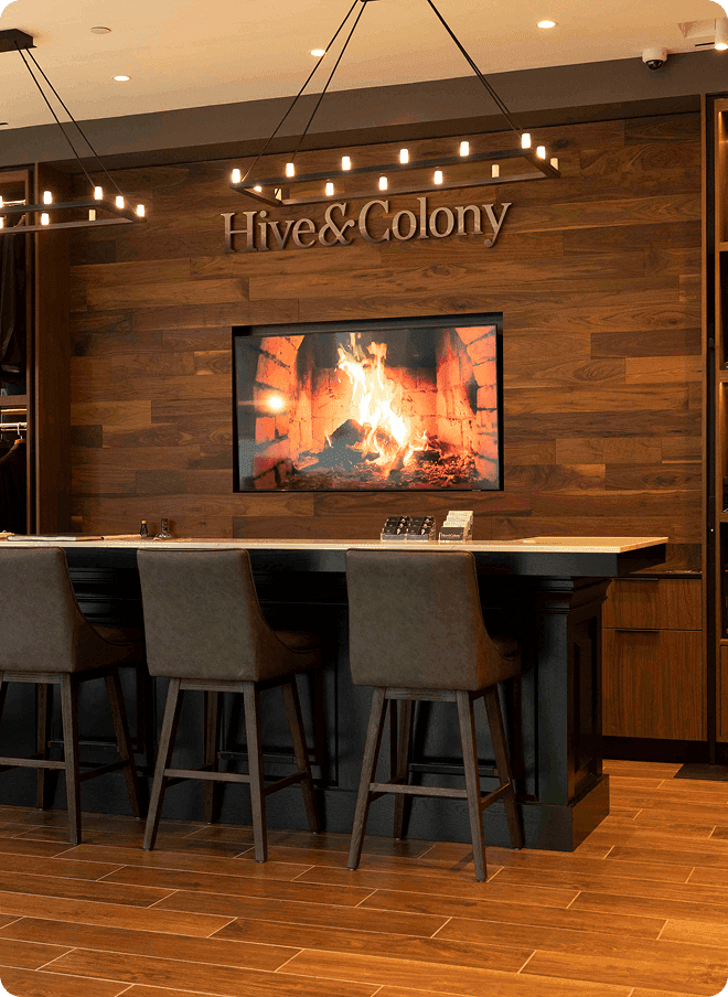 Hive & Colony fitting bar with a fireplace screen and pendant lights.