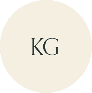 Cream circular monogram with KG initials.