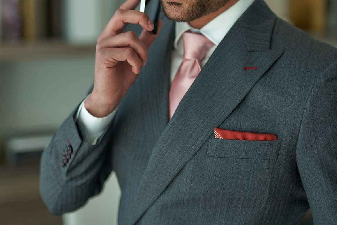 Close-up of bespoke suit details and tailored construction.