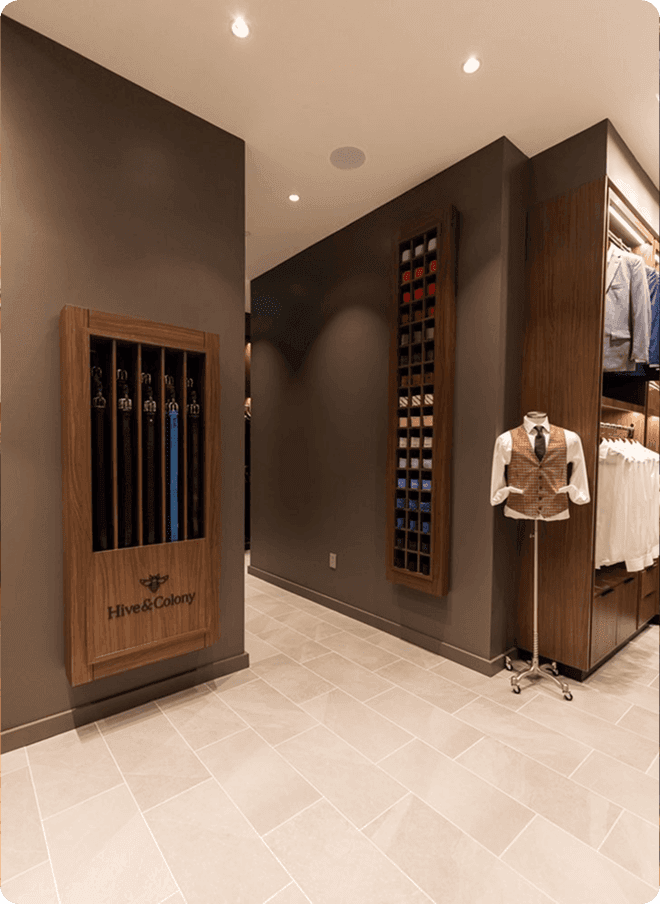 Dallas showroom hallway with umbrella display and waistcoat mannequin.