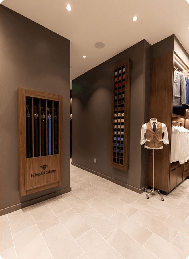 Dallas showroom hallway with umbrella display and waistcoat mannequin.