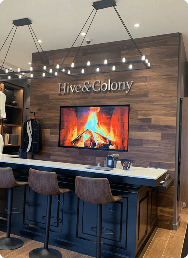 Showroom fitting bar with fireplace screen and pendant lights.