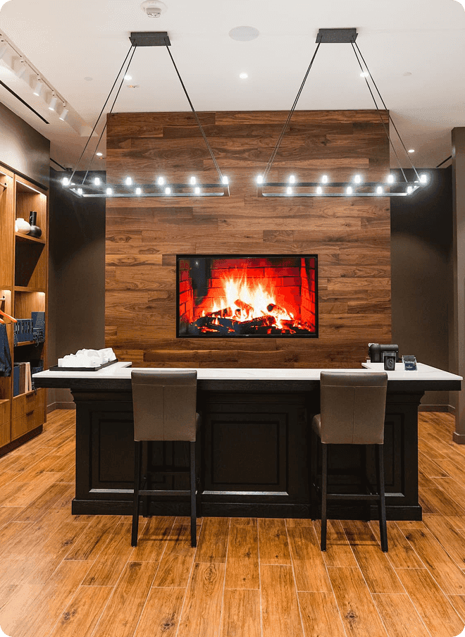 Santa Clara fitting bar with fireplace screen and pendant lights.