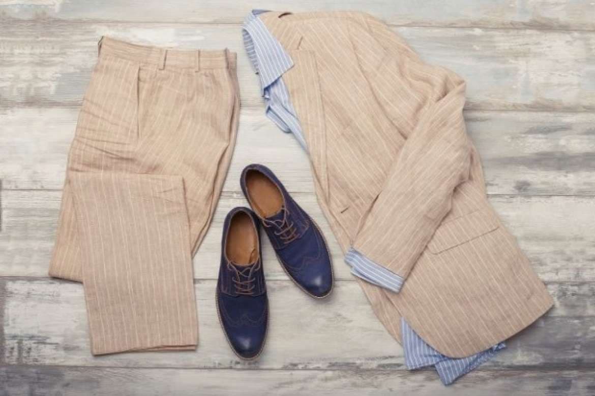 Lightweight linen suit styled for warm weather.