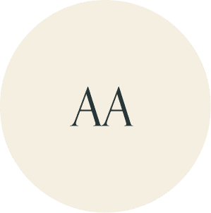 Cream circular monogram with AA initials.