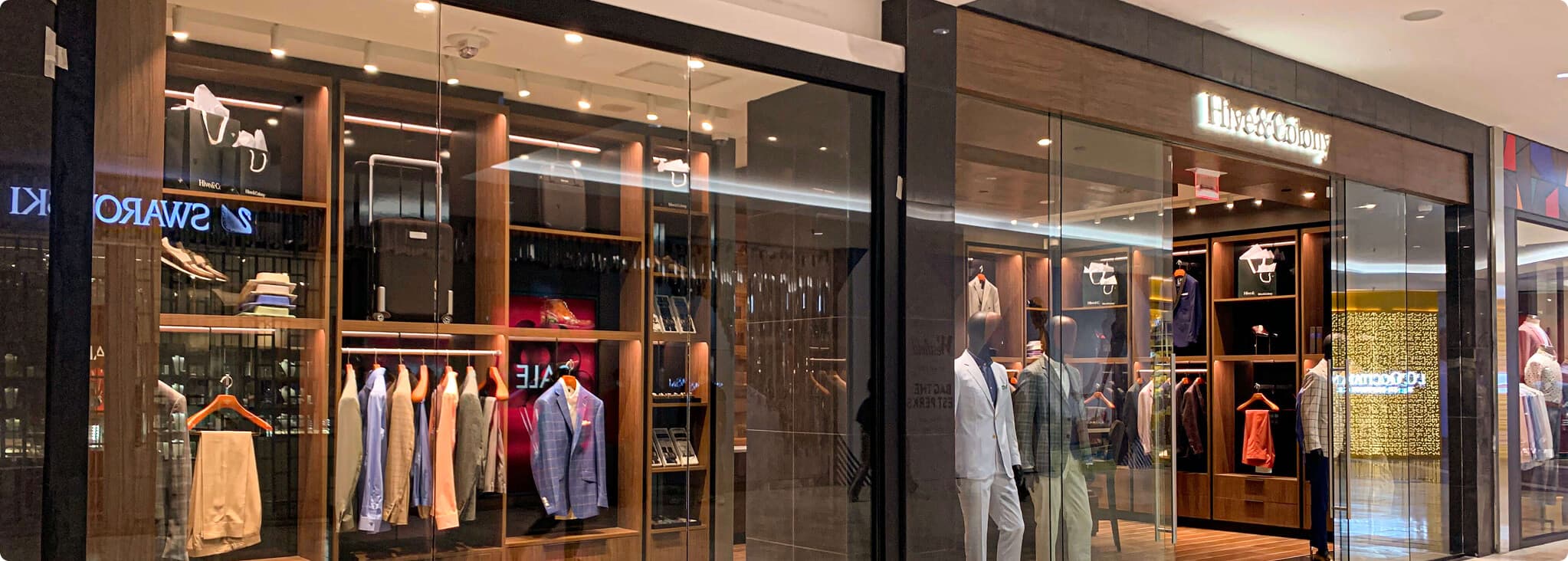 Hive & Colony mall storefront with suit and accessory displays.