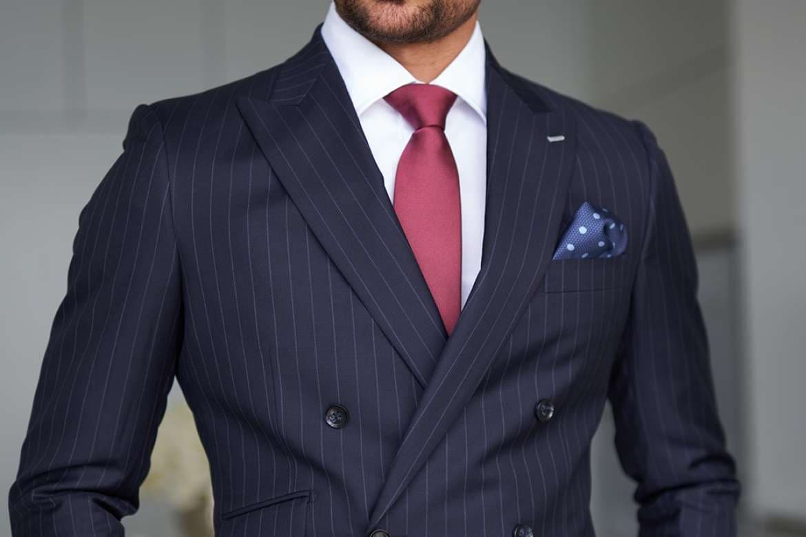 Man dressed in cocktail attire with a tailored jacket.