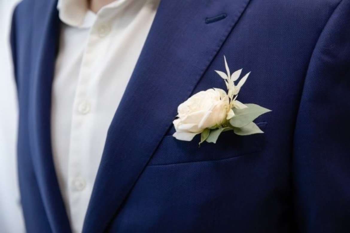 Men’s wedding attire styled with formal tailoring.