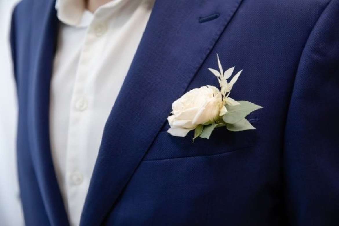 Men’s wedding attire styled with formal tailoring.