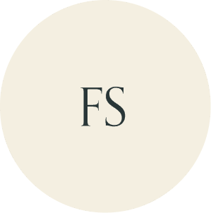 Cream circular monogram with FS initials.