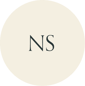 Cream circular monogram with NS initials.