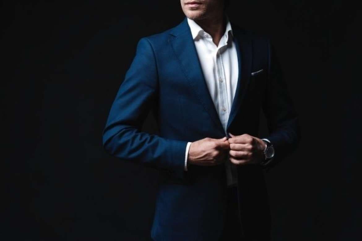 Essential men’s dresswear pieces arranged together.