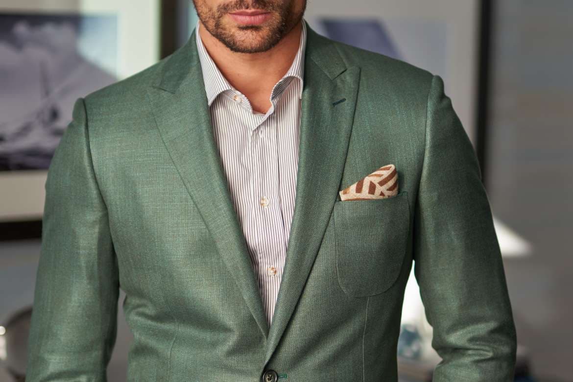 Man wearing a tailored three-piece suit.
