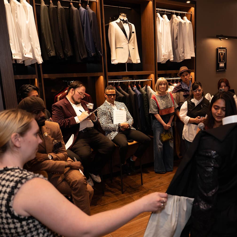 Guests attending the MassArt final presentation inside the Hive & Colony showroom.