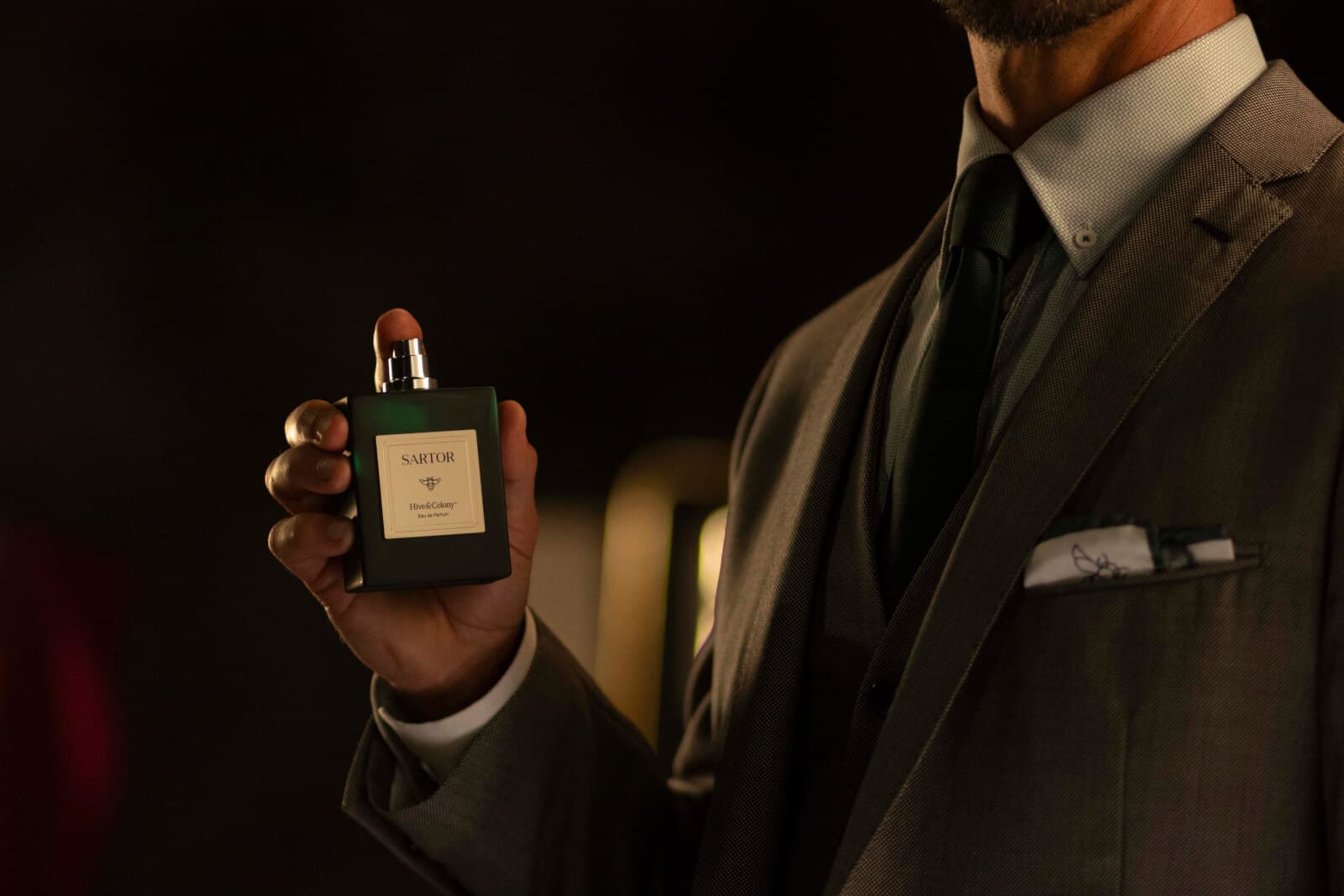 Man holding a bottle of Sartor