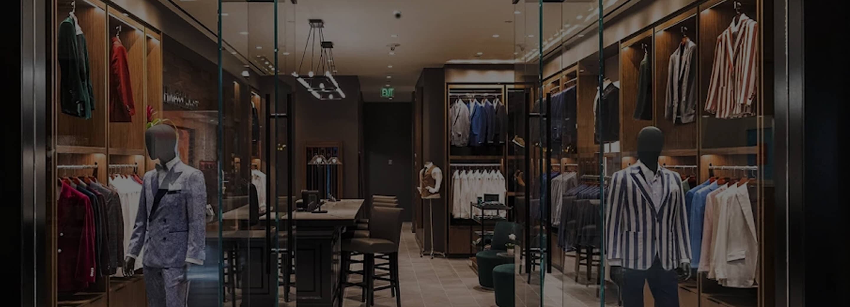 Hive & Colony showroom entrance with mannequins and tailored clothing.